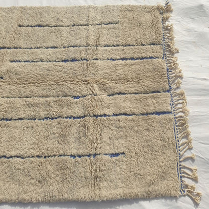 Ifawa - Beni Ourain Rug with Tonal Beige Field and Rare Blue Line Accents - Handwoven Berber Carpet | 6'6"x10'5" Ft | 198x317 cm