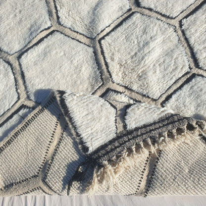Hand-knotted fringe and detailed black border framing the honeycomb pattern on 6x9 classic Beni Ourain Moroccan rug