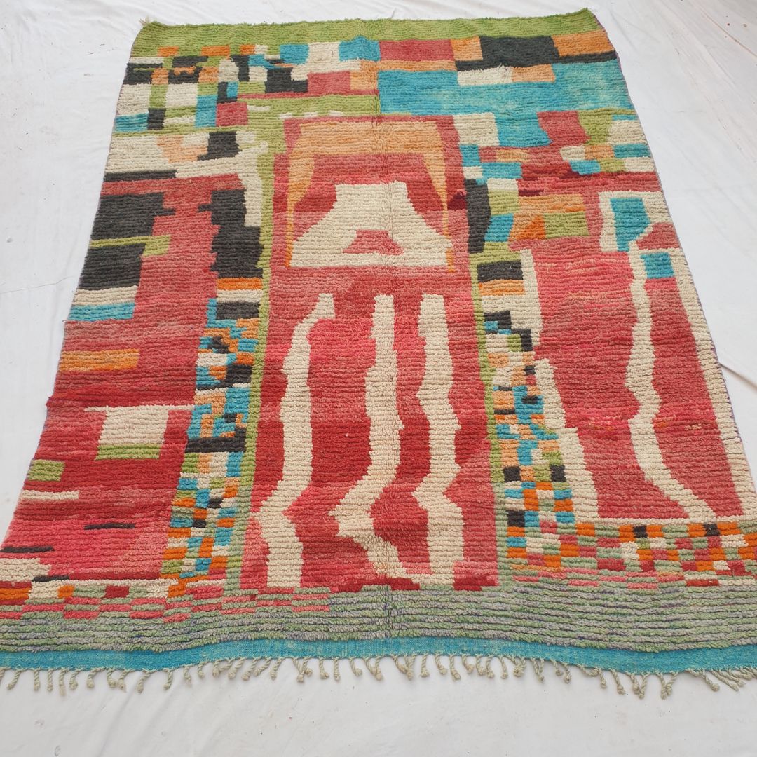 Authentic Boujad Moroccan rug 254×349 cm laid flat – vibrant red background with abstract geometric colorful patches in orange, turquoise, green, black and cream, handmade in Morocco by Berber women

