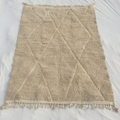 Authentic Beni Ourain Moroccan rug 207x281 cm laid flat - warm ivory and greige undyed wool base with a full-field classic diamond trellis in carved pile relief, the most iconic Beni Ourain composition handwoven in Morocco by Berber women