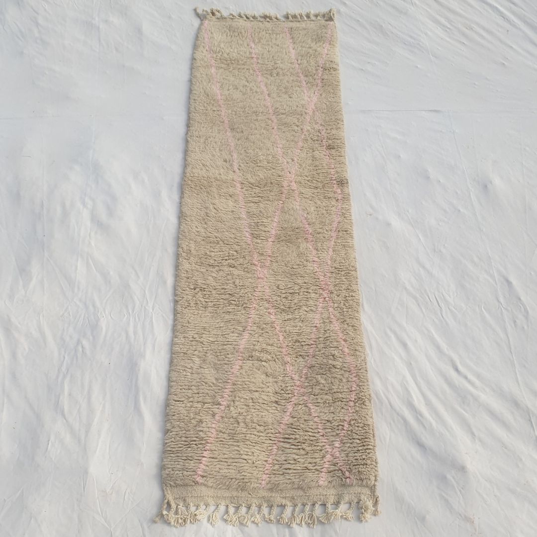 Authentic Beni Ourain Moroccan runner rug 84x284 cm laid flat - luminous ivory wool base with delicate sparse dusty pink diagonal lines crossing the field, the most minimal colour statement in our collection, handwoven in Morocco by Beni Ourain Berber women