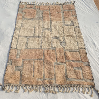 Authentic Beni Ourain Moroccan rug 196x280 cm laid flat - two-tone block patchwork in soft blush-rose and natural ivory/white wool with a grey-blue grid, handwoven in Morocco by Beni Ourain Berber women