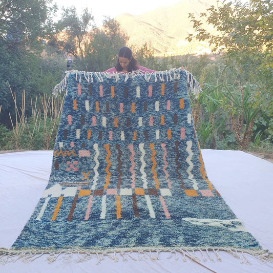 Vibrant blue abstract Beni Ourain shag rug 6x10 ft with pink orange ivory motifs – handwoven Moroccan wool berber carpet