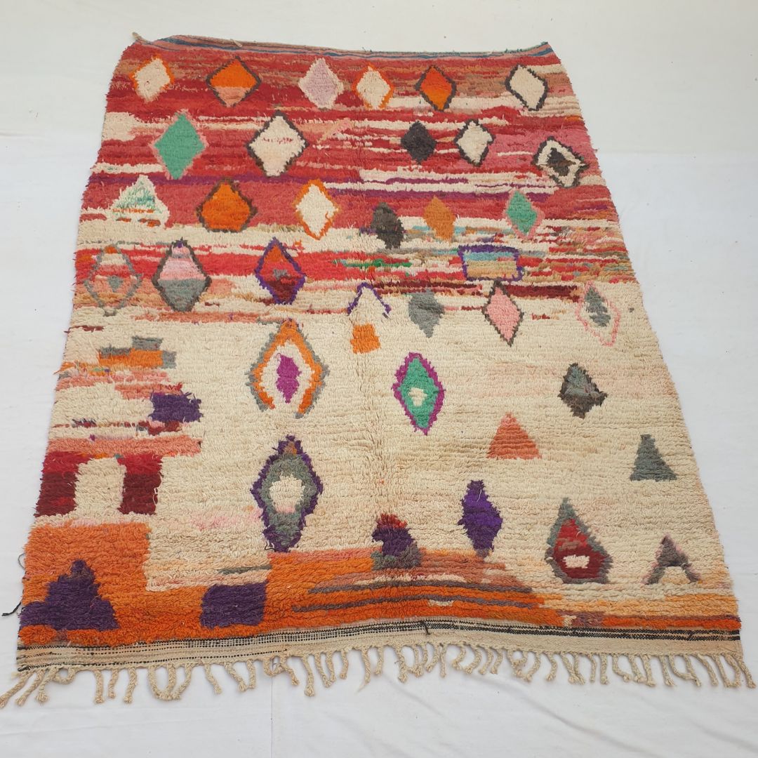 Soft plush wool pile and rich natural color variations of vibrant red diamond abstract Boujad Berber Moroccan rug