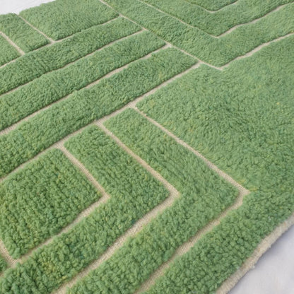 Ultra fluffy thick high-pile wool texture detail of vibrant green Beni Ourain plush shag rug