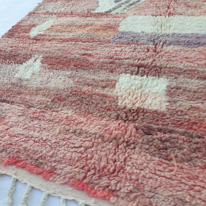 Soft handwoven wool pile of vintage red and pink Boujad Moroccan Berber rug showing rich texture and natural color variations