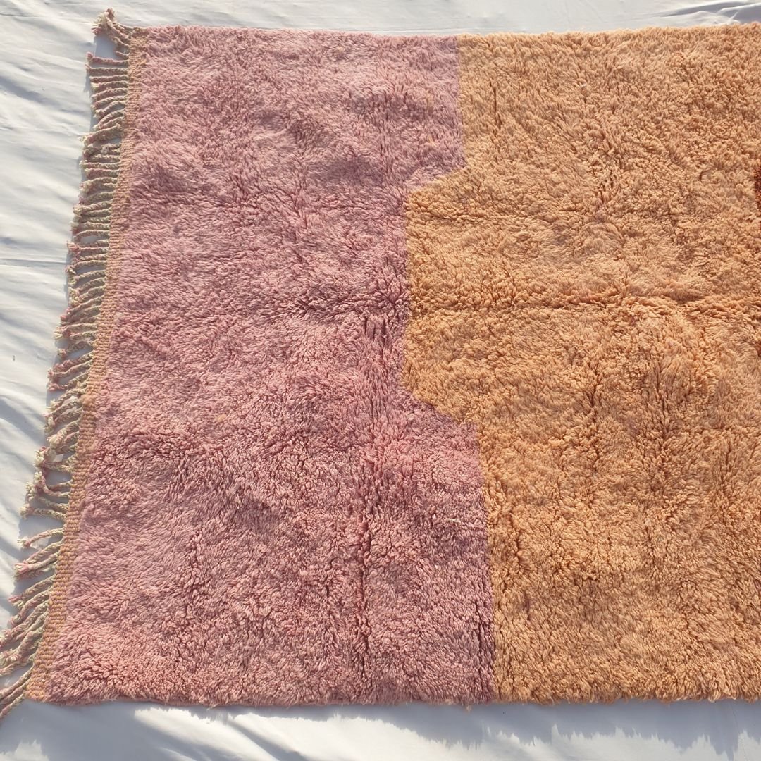 Vibrant abstract horizontal color fields in pastel pink, orange, and beige highlighting fluffy weave of the Moroccan wool rug