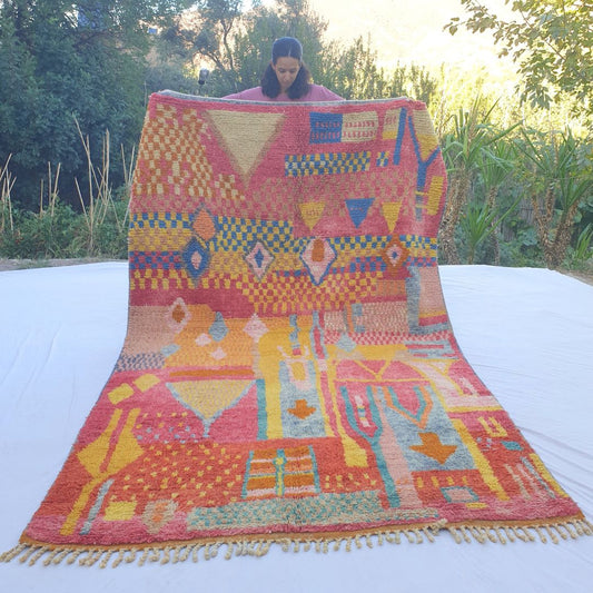 Playful pink yellow abstract Boujad rug 6x10 ft with checkerboard and geometric motifs – handwoven colorful Moroccan wool