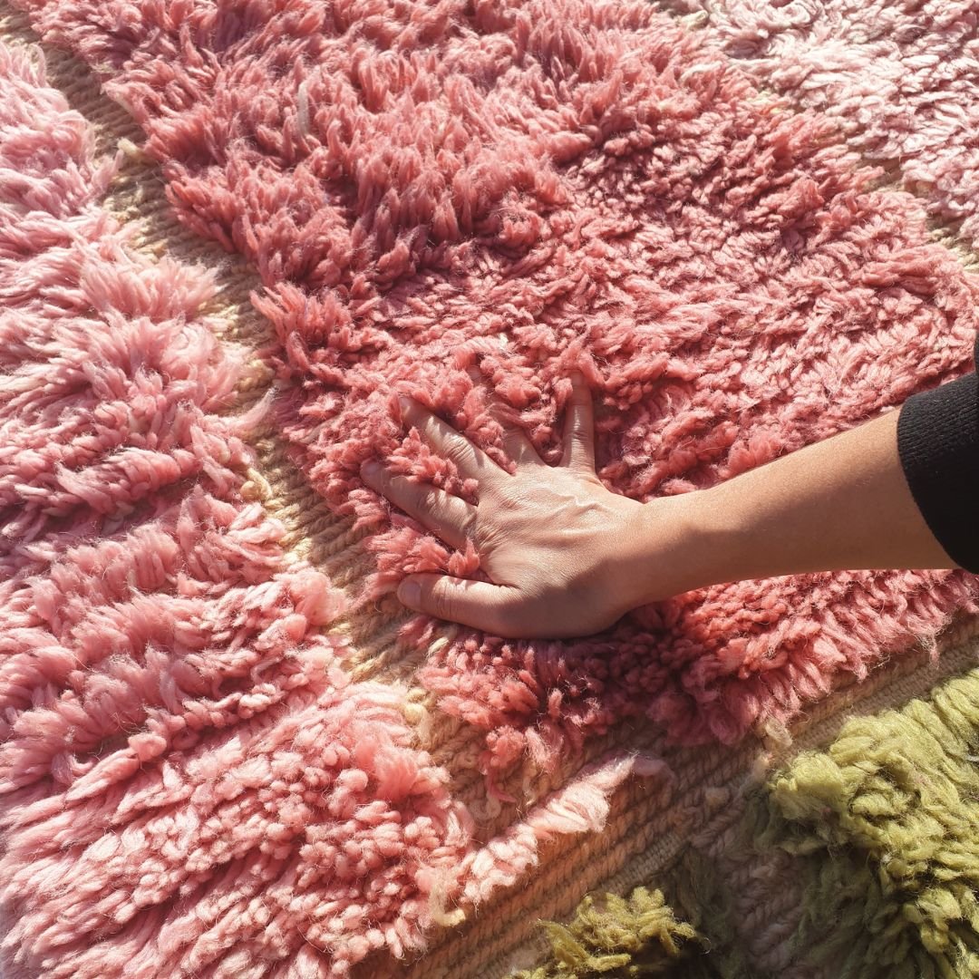 Close-up of dense ultra-plush shag pile and soft natural wool texture on handmade Beni Mrirt olive green and pink runner