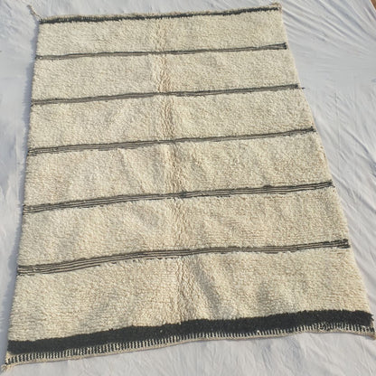 Authentic Beni Ourain Moroccan rug 211x284 cm laid flat - ivory natural wool base with clusters of black horizontal stripes and a checkered border, handwoven in Morocco by Beni Ourain Berber women