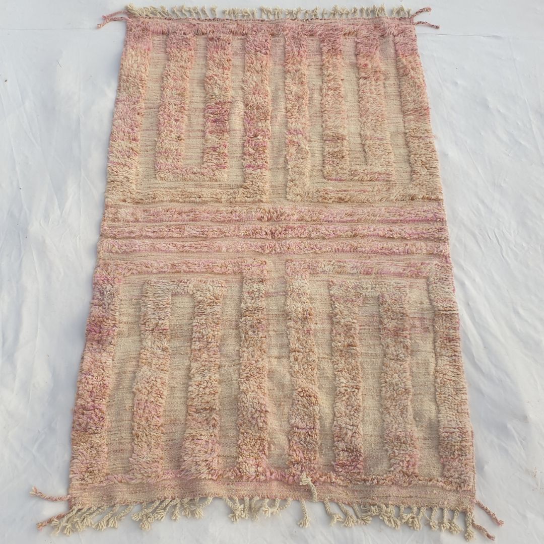 Authentic Beni Ourain Moroccan rug 148x237 cm laid flat - warm dusty rose blush pink wool base with a tonal geometric maze rectangular key pattern in two mirrored panels, handwoven in Morocco by Beni Ourain Berber women