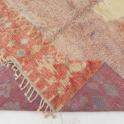 Hand-knotted fringe and detailed border in warm earthy tones framing the bold vibrant geometric tribal design on 8x11 large Boujad Moroccan rug