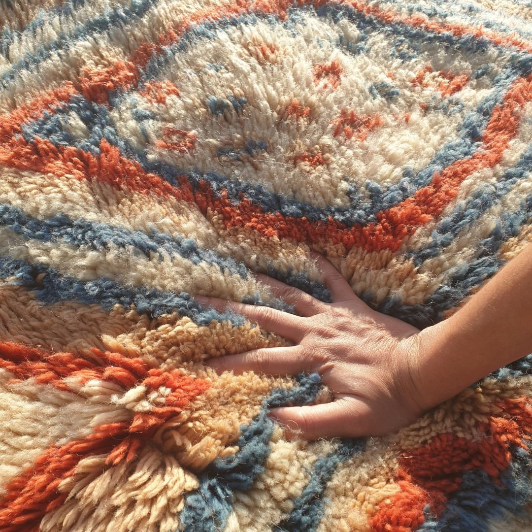 Close-up of dense, thick shag pile and soft natural wool texture on handmade Beni Mrirt luxury rug