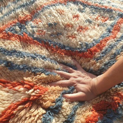 Close-up of dense, thick shag pile and soft natural wool texture on handmade Beni Mrirt luxury rug