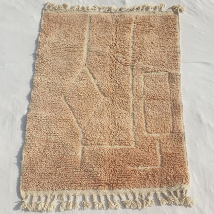 Authentic Beni Ourain Moroccan accent rug 104x144 cm laid flat - warm beige wool base with a carved diamond and rectangular relief pattern, handwoven in Morocco by Beni Ourain Berber women